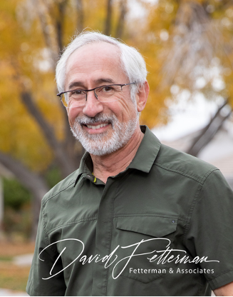 This is a picture of David Fetterman with white hair and a green shirt. It has his autograph on the bottom of page with his company’s name:  Fetterman & Associates