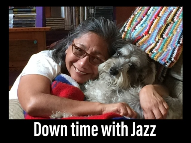 Norma Martínez-Rubin having down time on the couch with dog Jazz.