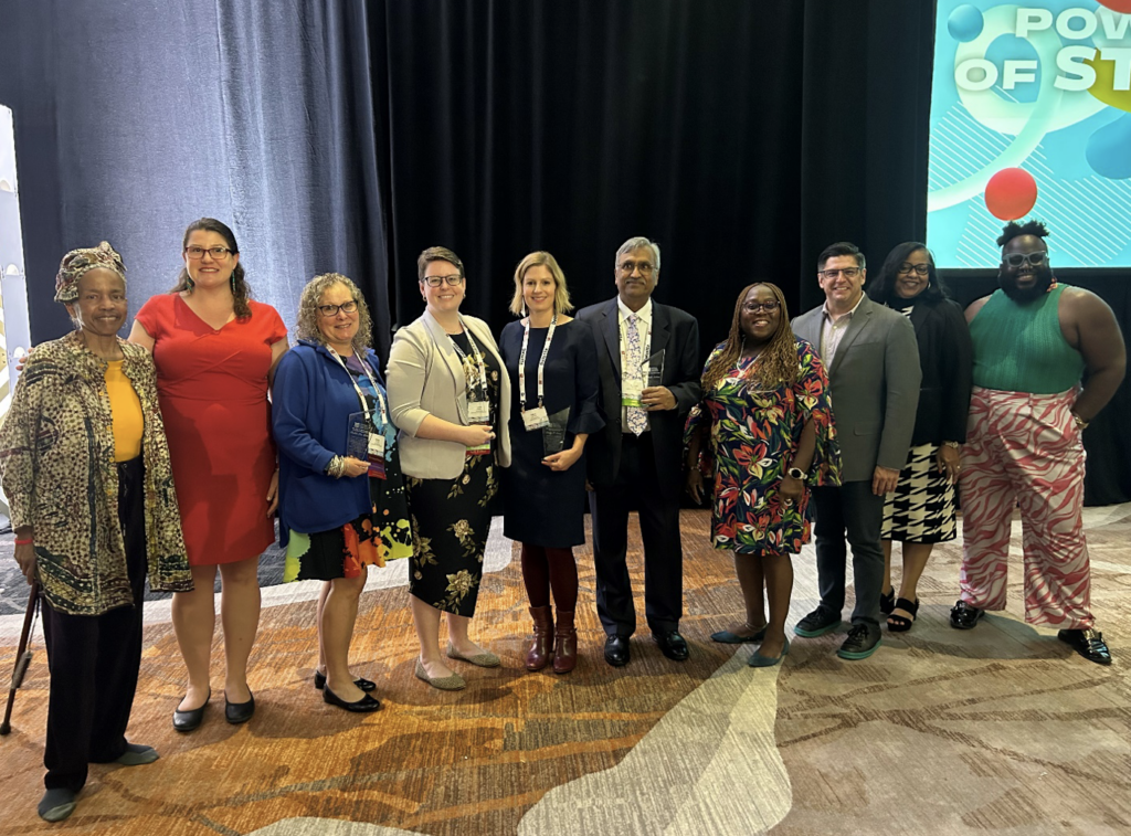 The 2023 AEA Award Recipients with AEA President Corrie Whitmore, Awards Working Group Co-Chairs Eric Barela and Felicia Bohanon, and Membership and Operations Manager Zachary Grays at the Awards Plenary. 